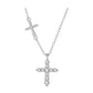 Small cross set into the fine cable chain above the hanging cross pendant
