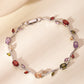 Zircon gold leaf bracelet held in a hand to show its slim scale