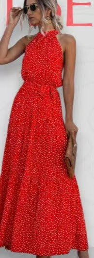 Red polka dot halter neck sleeveless tiered swing maxi dress worn by a model