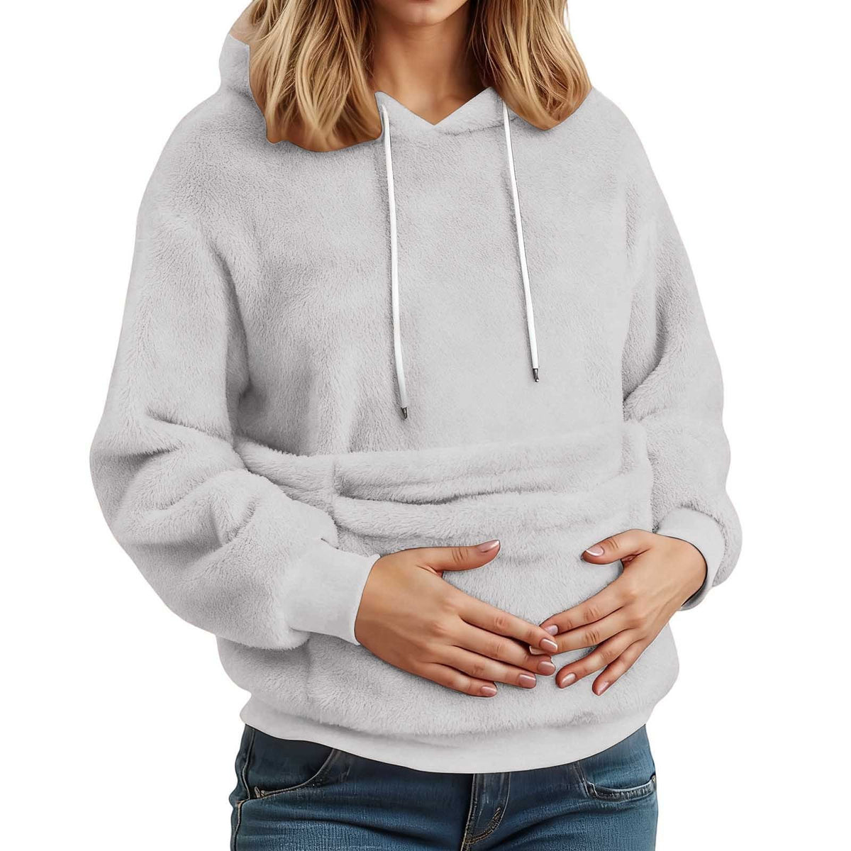 Light gray plush fleece hoodie on a model with both hands in the large front pocket