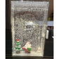 Christmas LED scene box with a Santa, tree, and snowman figures under faux snow and a lit lamp