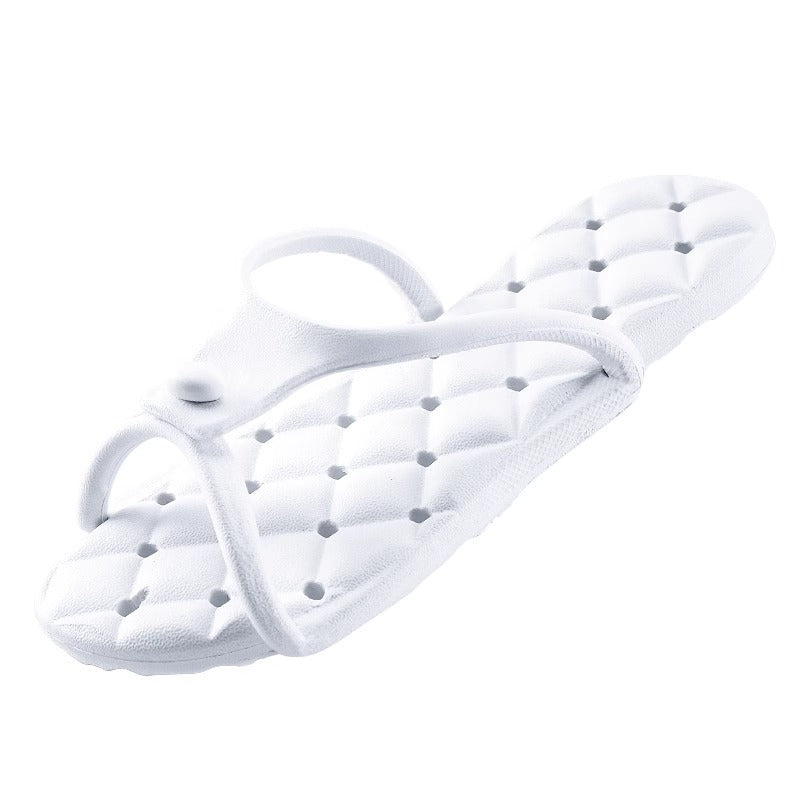 Cushioned EVA thong slipper with a between the toes strap and a quilted footbed