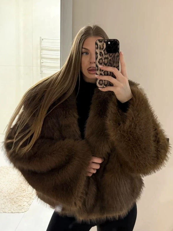 Coffee brown long pile vegan fur short jacket worn open over a black top