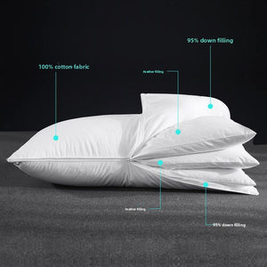 Two adjustable down bed pillows stacked, one lofted and one flat, on a plain background