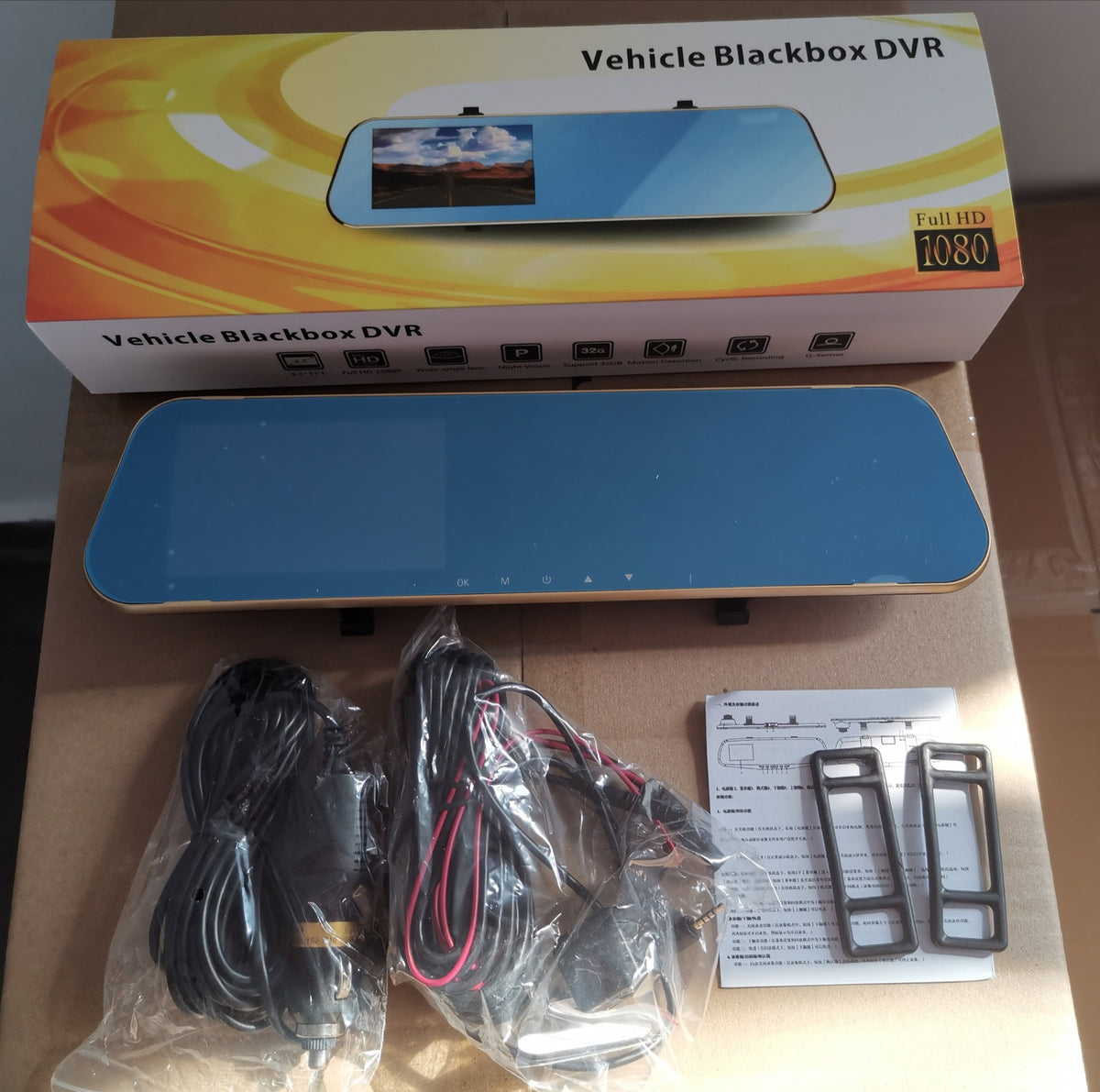 Mirror dash cam in a gold toned box with cables and straps, option image for the 4.5in Gold-Bezel option