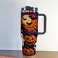 40oz insulated tumbler printed with a purple haunted night Halloween design