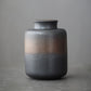 Ceramic storage jar shown with its packaging and included contents