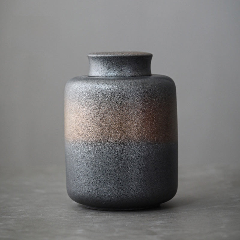 Ceramic storage jar shown with its packaging and included contents