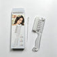 Transparent white scalp liquid comb beside its Crystal Scalp Liquid Comb gift box and a dropper pipette, box option