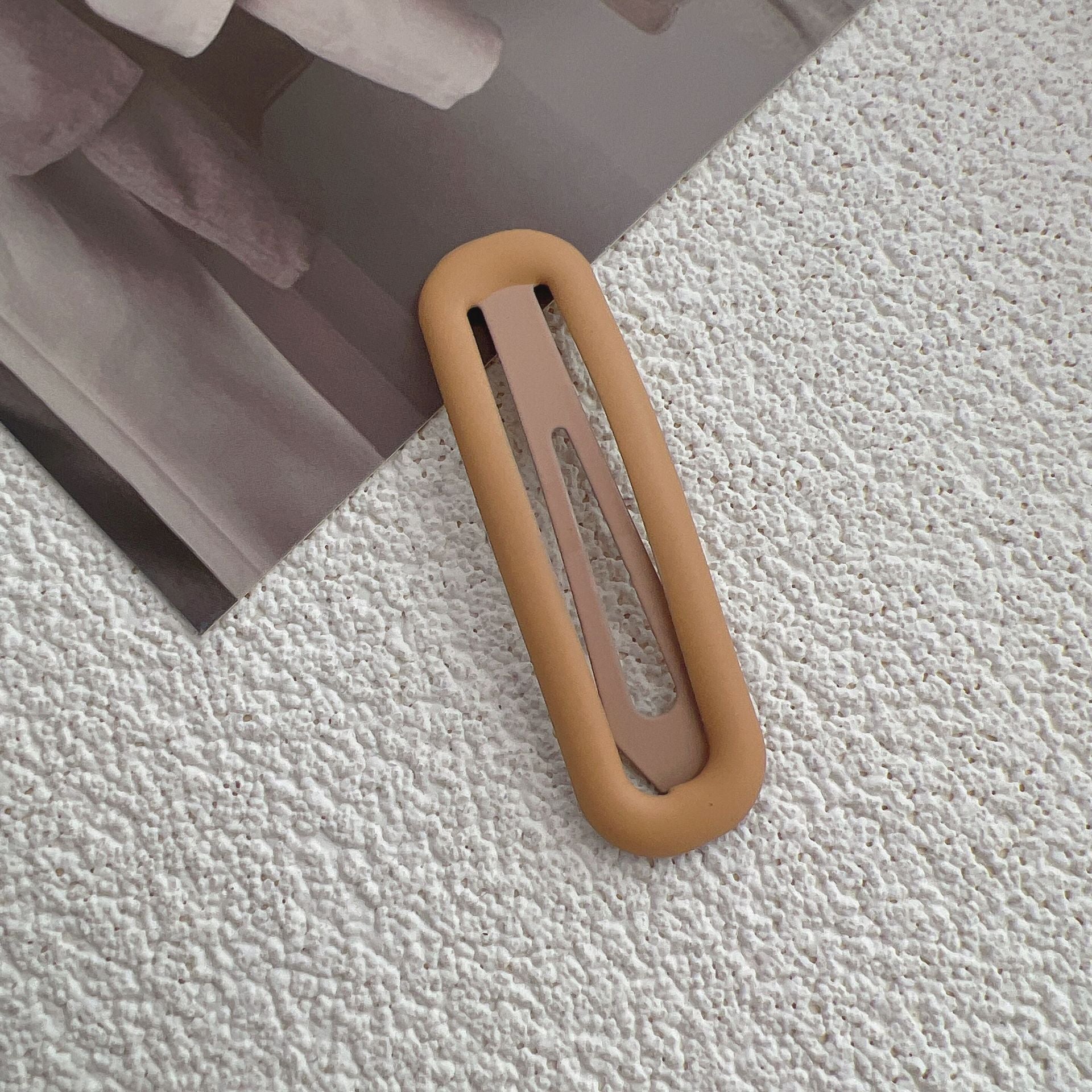 Matte snap hair clip with open rounded shape