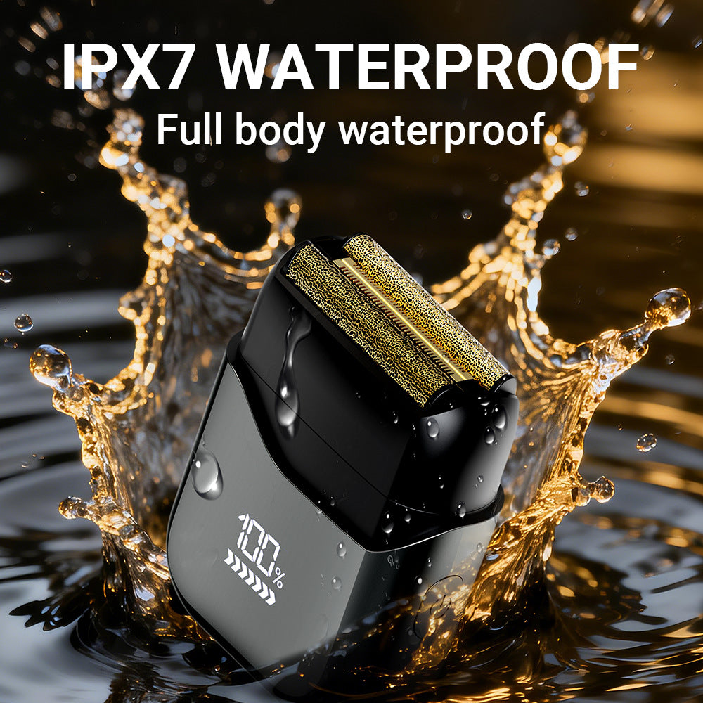 Black foil electric shaver splashed with water to show the IPX7 waterproof body