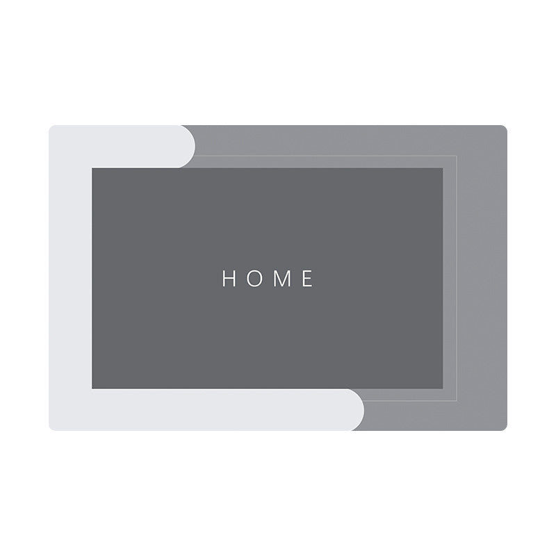 Grey rectangular quick dry bath mat with a flat surface and a HOME print