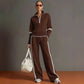 Full length view of the Brown two piece set, white trim at the collar and ribbed cuffs