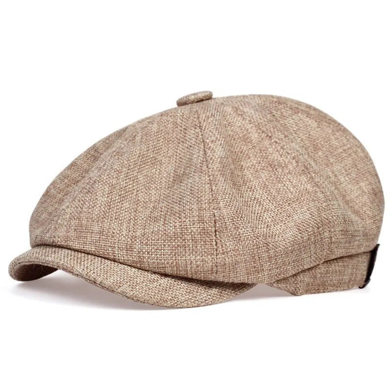 Vintage newsboy flat cap with an adjustable back tab and short stitched brim
