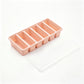 Peach pink six cavity strip tray with its clear lid lying beside it, option 6 Cavities Strip Tray, Peach Pink