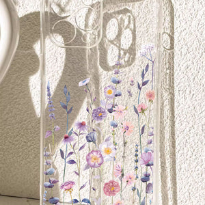 Clear TPU phone case with a purple wildflower print shown on a phone