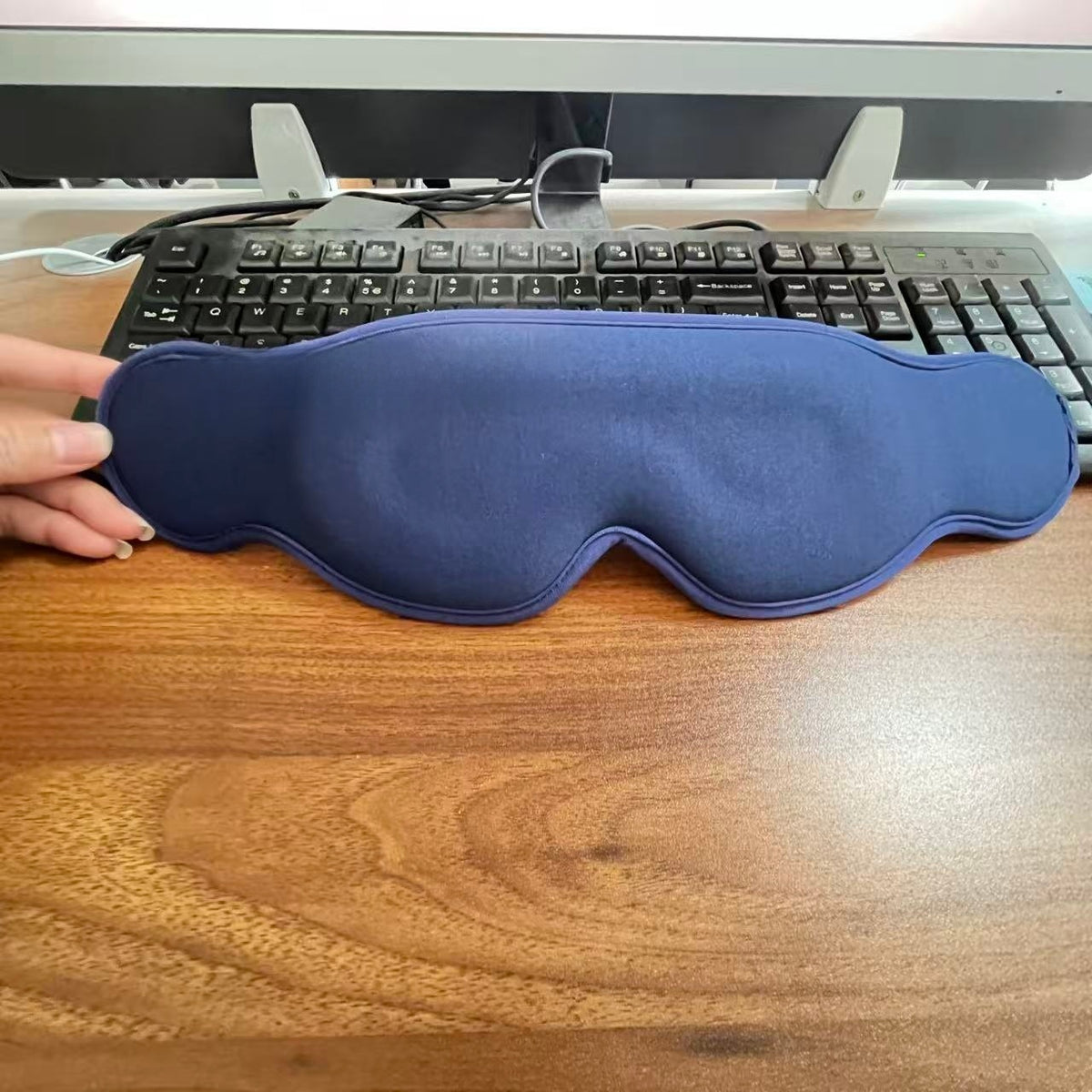 Navy blue 3D contoured sleep eye mask on a desk in front of a keyboard, Eye Mask 3D Blue option