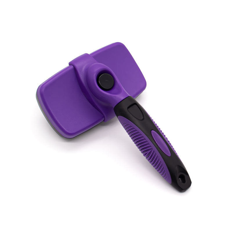 Purple self cleaning pet slicker brush with the black retract button and textured handle grip
