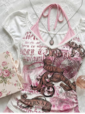 White faux halter two piece tee styled with a perfume bottle and a rose print card