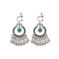 Handmade bohemian clip-on earrings with tassel and bead drop detail, zinc alloy frame, studio shot on white background