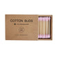 Double-headed makeup swab beside everyday makeup bag and beauty kit essentials