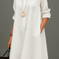 White polyester shirt collar long sleeve A-line midi dress on a standing model