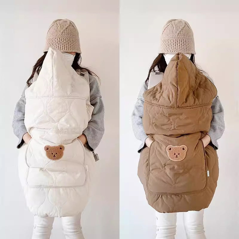 Off-white and coffee quilted baby capes shown side by side on a carrier