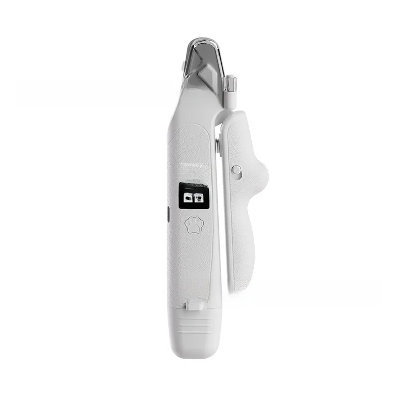 Closeup of white pet nail clipper blades, clear guard and coil spring mechanism