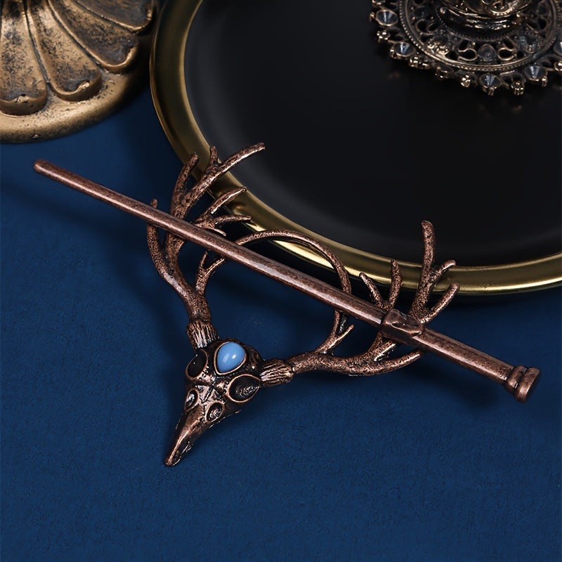 Nordic viking hairpin showing crow skull and antler motif