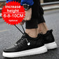 Black low-top sneakers with a Fashion tag strap, laces being tied outdoors, with a height badge