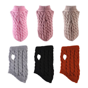 Cable knit dog sweater laid flat showing the ribbed turtleneck, cuffs, and hem