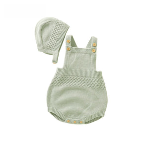 Baby knit romper shown with the hood buttoned on