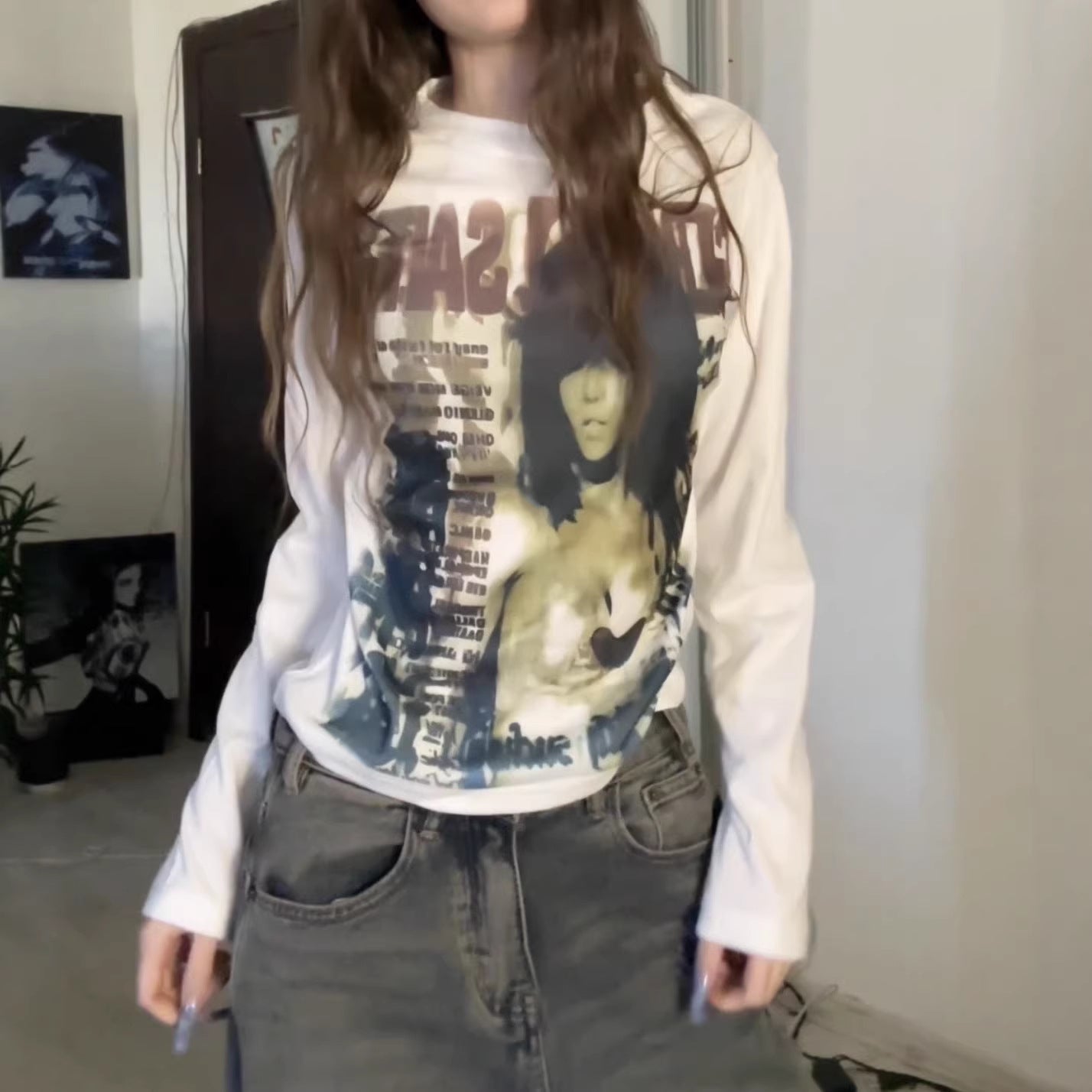 Y2K anime graphic long sleeve tee shown on a model with low rise denim