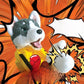 Husky plush hand puppet in a yellow outfit throwing a red boxing glove punch on a comic background
