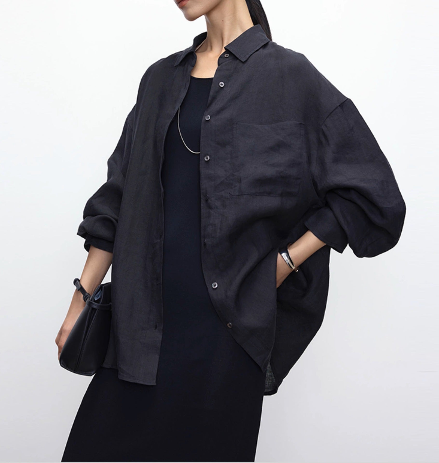 White linen shirt worn open as a light summer layer