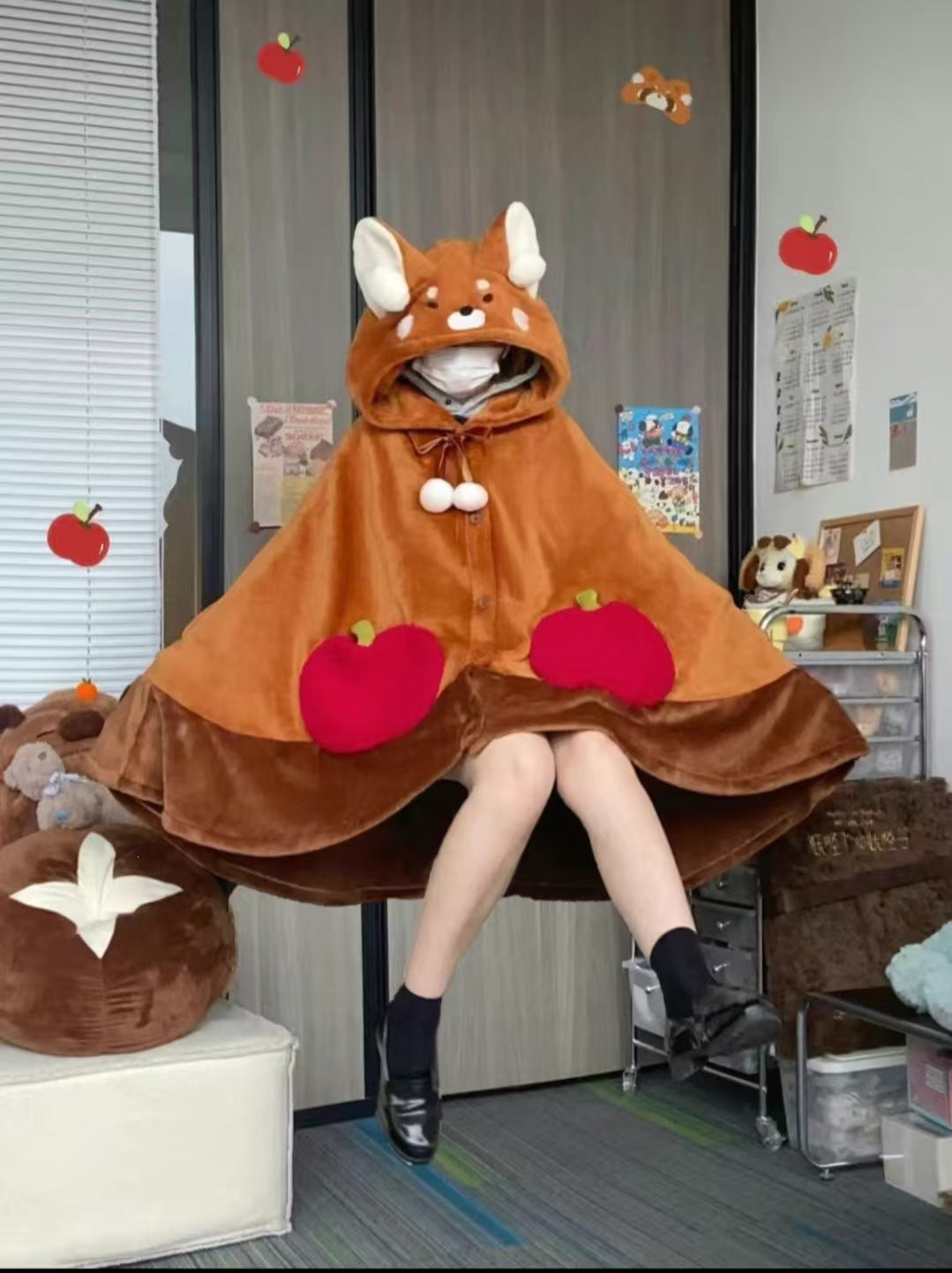 Hooded animal cape blanket shown as a cozy wearable throw for adults