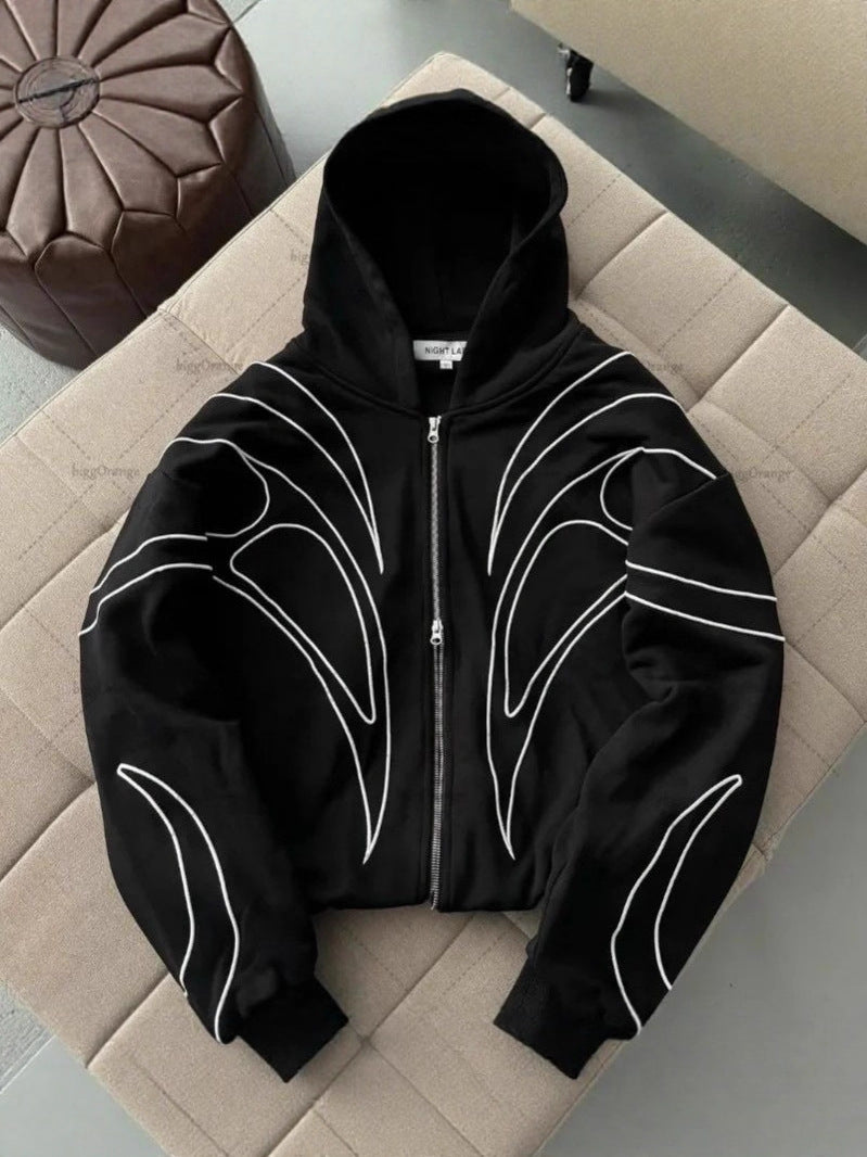 Close view of white line embroidery on the shoulder of a black hoodie