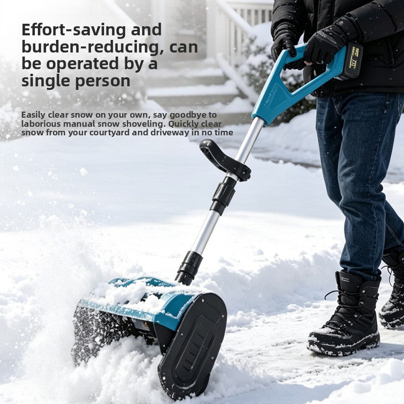 Person pushing the cordless snow blower along a snowy path, throwing snow aside