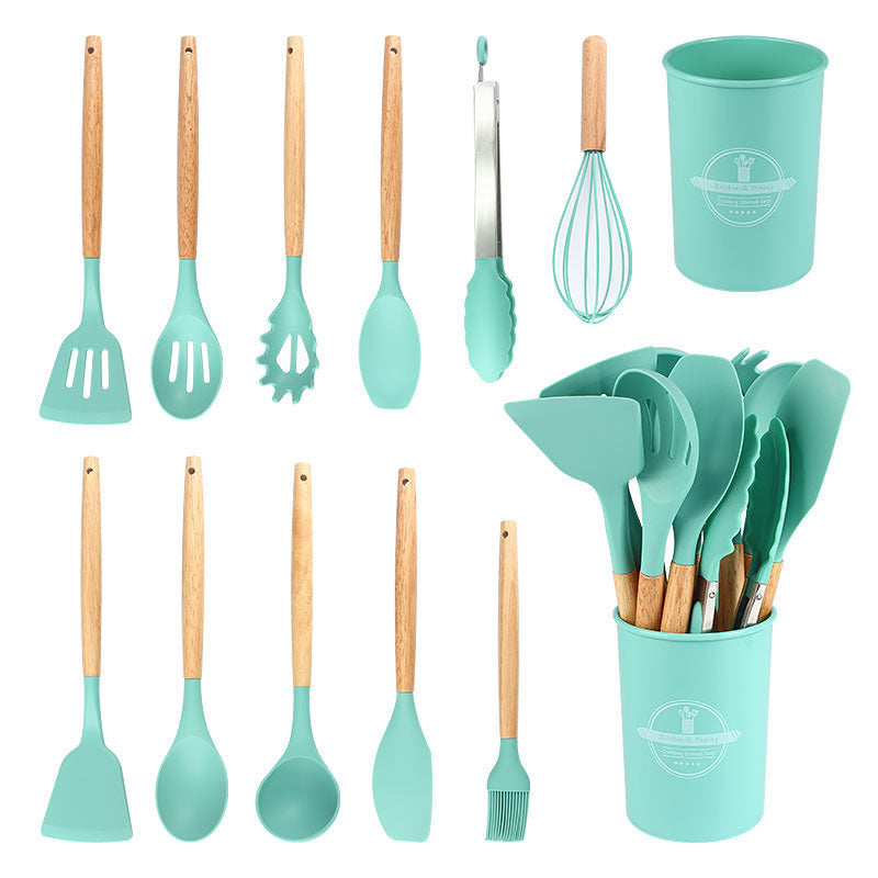 Mint green kitchen utensil set shown in rows next to the filled storage holder