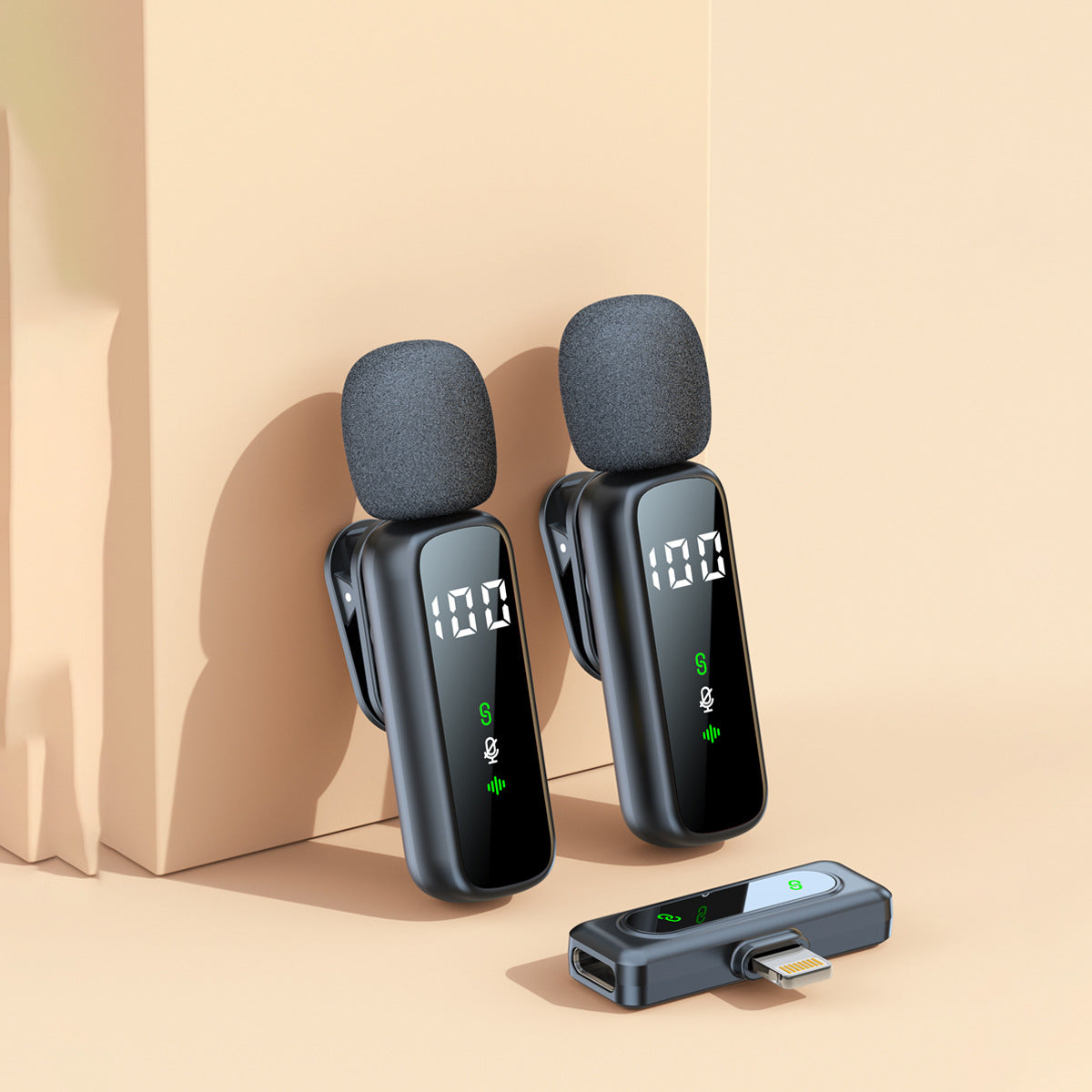 Two wireless lavalier clip mics with a Lightning receiver on a beige background