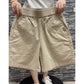 Navy blue high waist wide leg casual shorts worn with a light top