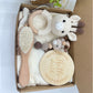 Crochet rattle and pacifier clip set shown with its packaging