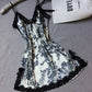 Satin slip nightdress printed with black flowers on a pale ground and edged in black lace, option photo for size M