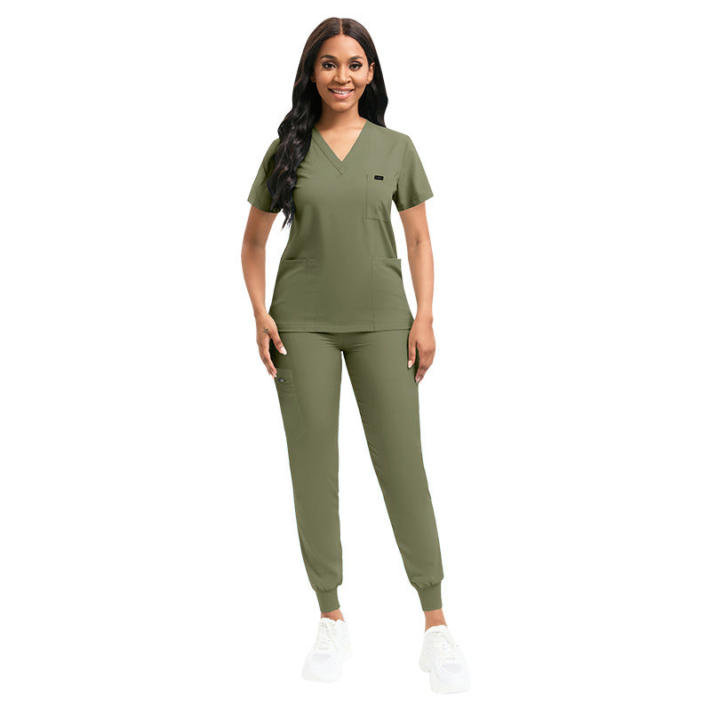 Unisex scrub top and pants shown flat as a matching two piece set