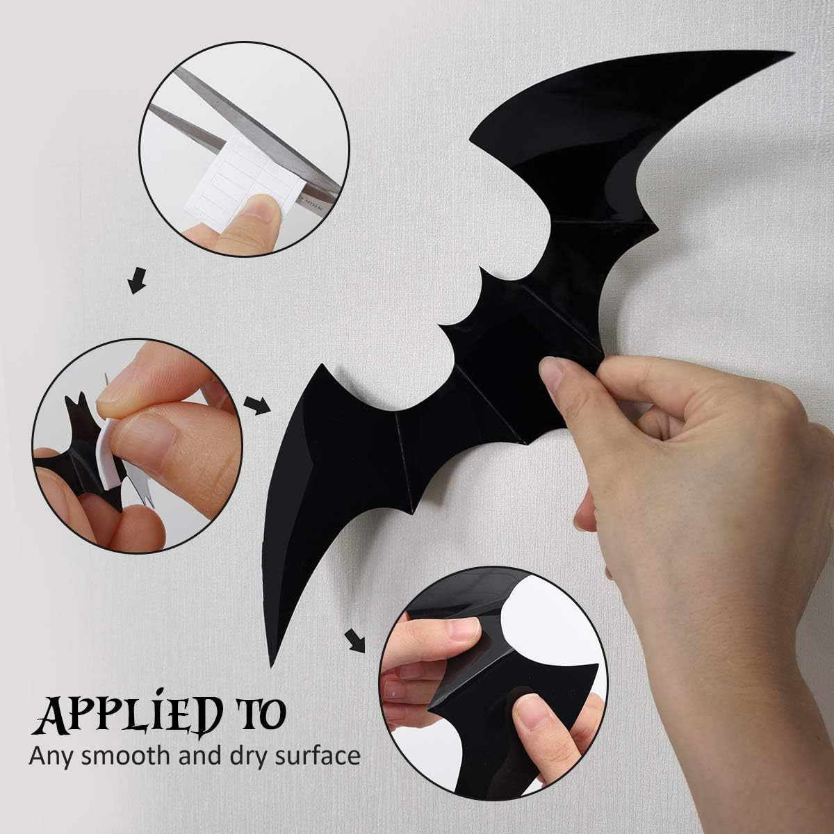 Group of black PVC bat wall stickers in a drifting cloud across a white wall