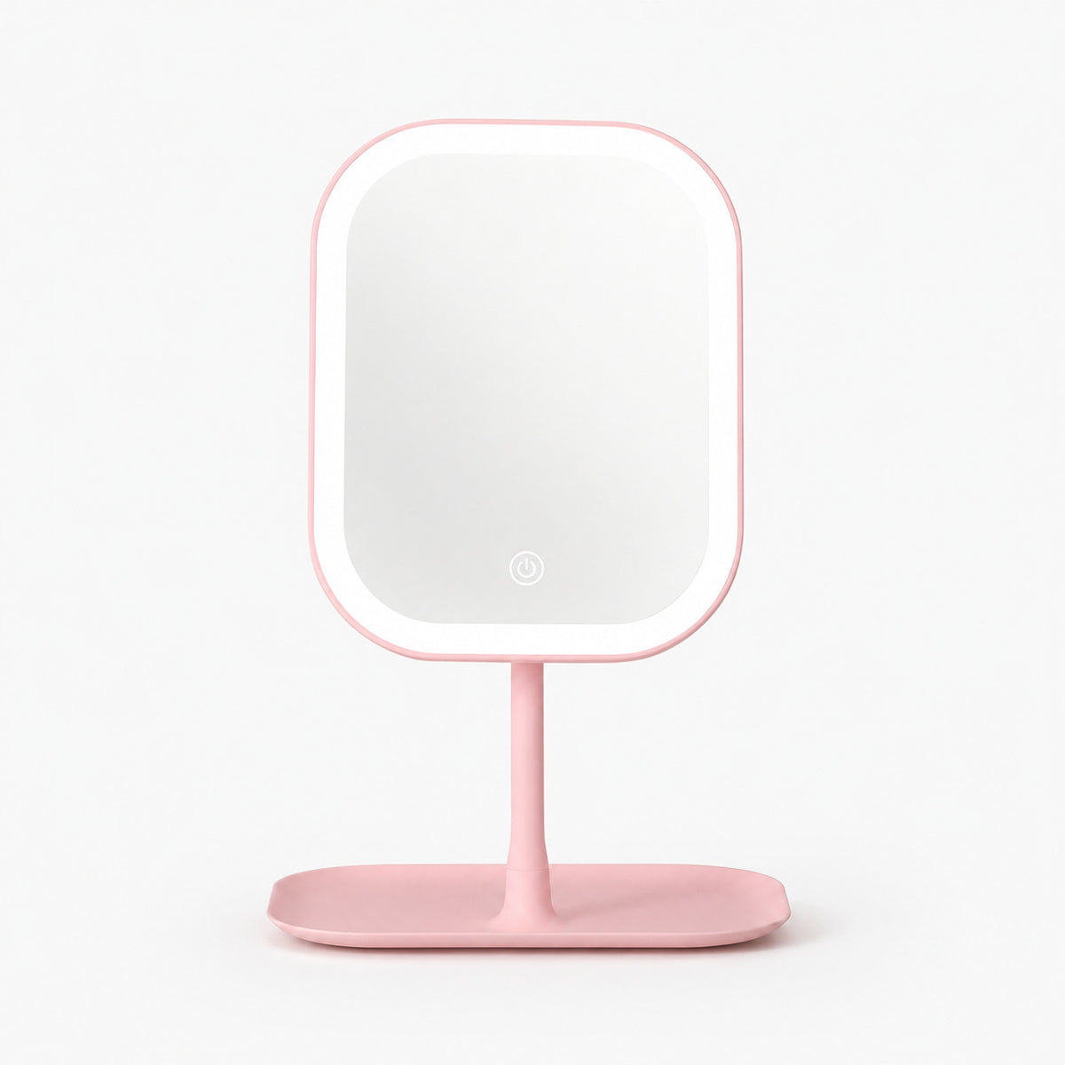 Pink square LED makeup mirror on a pink tray base on a white background