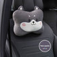 Gray dog cartoon headrest pillow with a spiral cheek mark on a black car seat, two pack badge