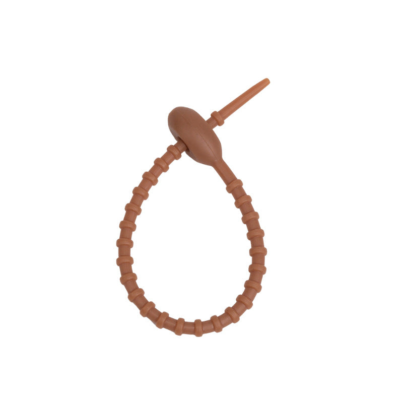 Close view of the ridged silicone strap and the tadpole head that holds the loop
