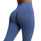 Close up of steel blue leggings from behind with contoured seam and ribbed waistband