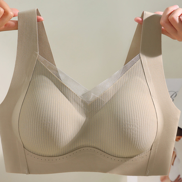 Wide vest strap seamless wireless bra shown on the shoulder without underwire